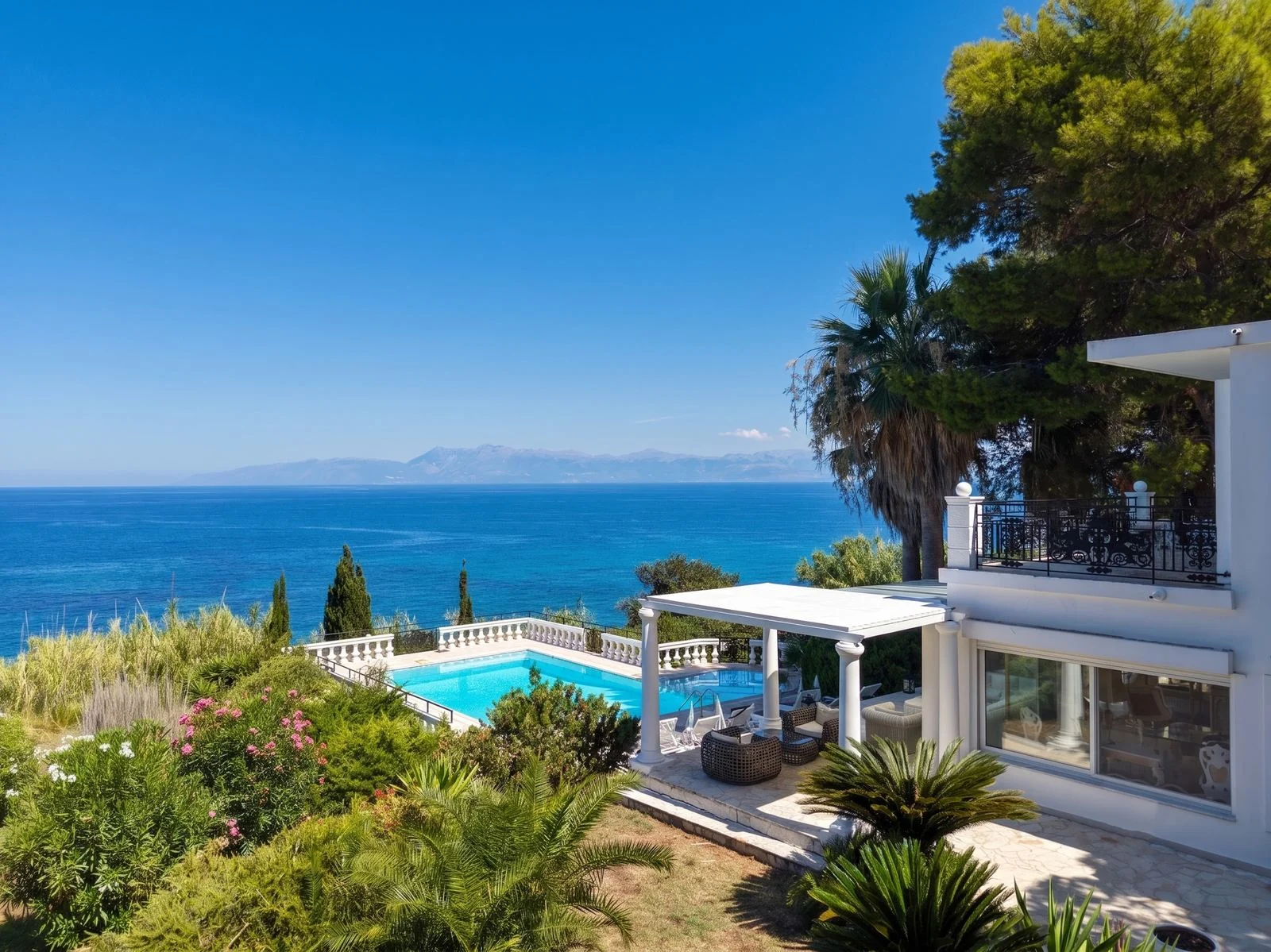 Pool terrace and villa above the Ionian Sea, Corfu