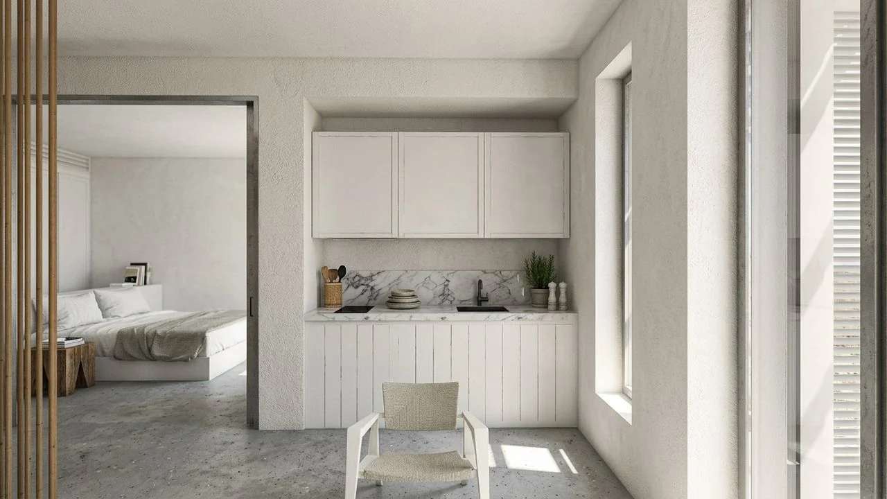 Render of a suite kitchenette and bedroom beyond